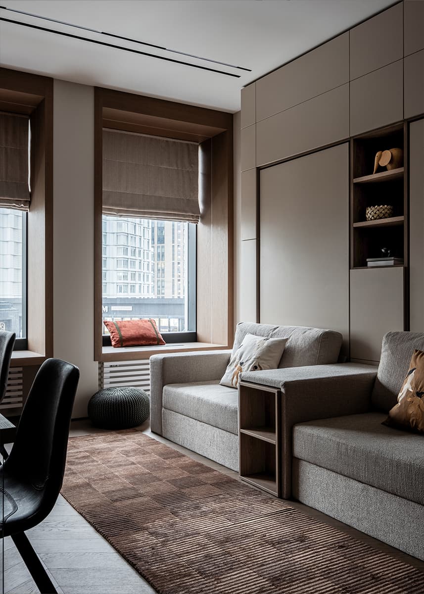 Сдержанный интерьер квартиры с необычной мягкой мебелью — проект cтудии дизайна интерьеров «TOP Interior»