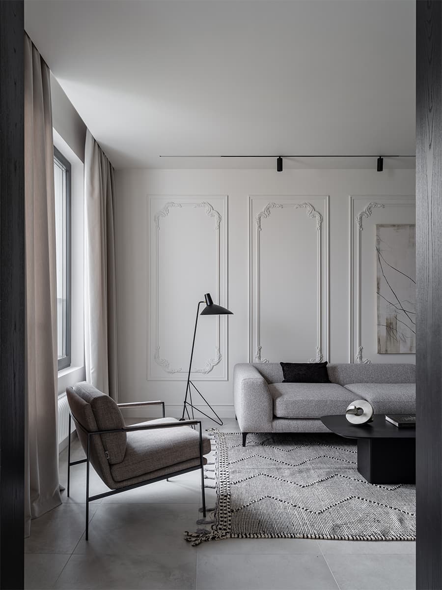 Монохромная палитра в интерьере компактной квартиры под сдачу — проект Attic Studio